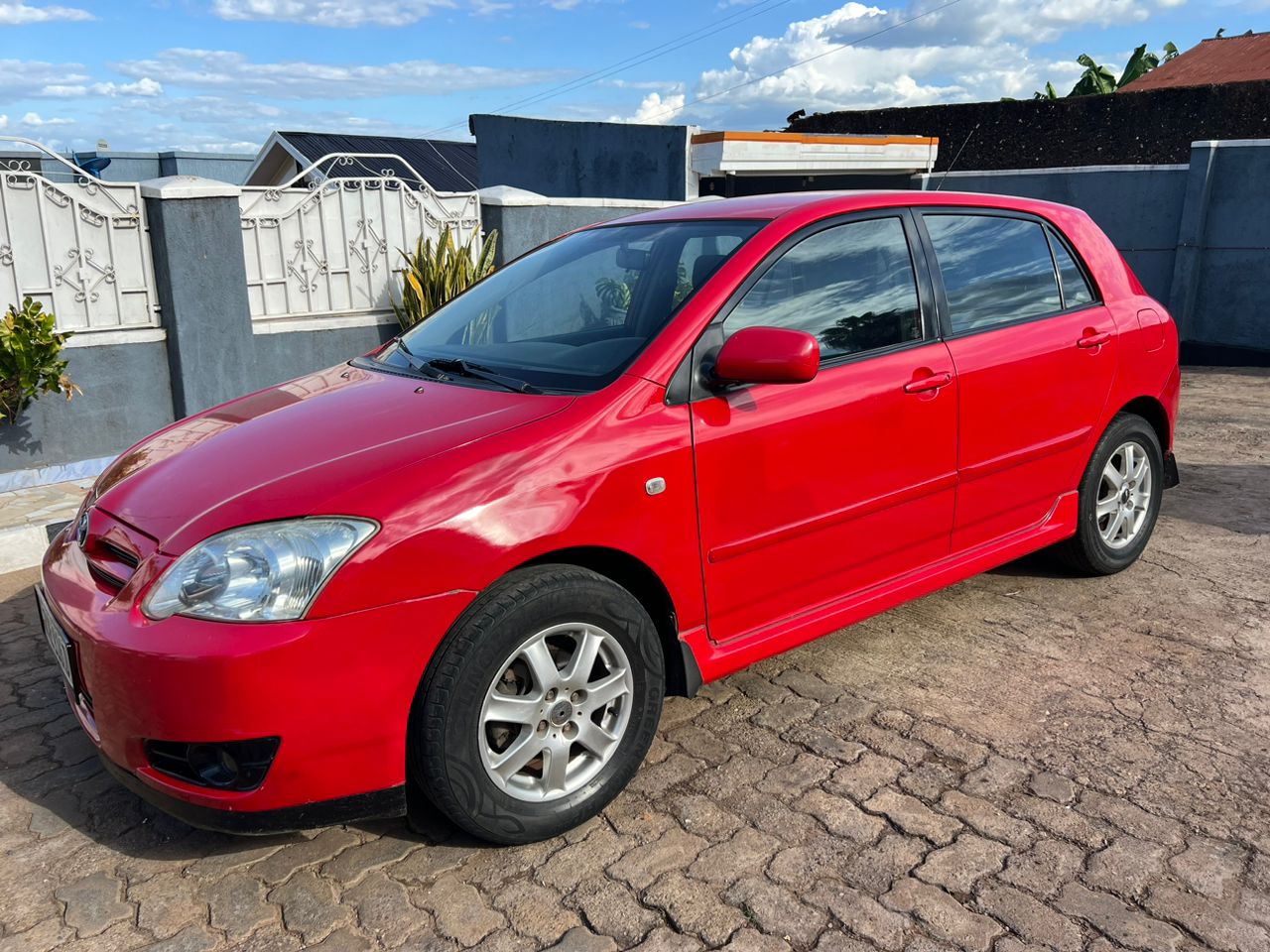 Toyota Hatchback parked on a city street, ideal for urban and road trips